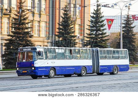 Ekaterinburg, Russia - May 8, 2012: White And Blue Articulated Bus Ikarus 283 In The City Street.