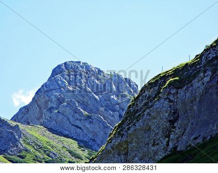 Mountain Hikers On The Alpine Peak Of Margelchopf And In The Alviergruppe Mountain Range - Canton Of