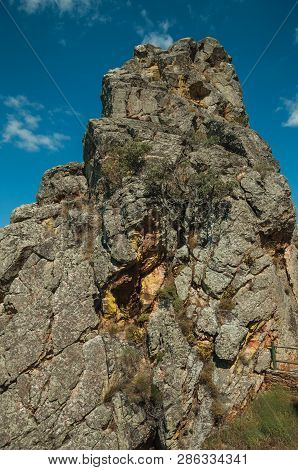 Close-up Of Rocky Cliffs With Bushes, In A Sunny Day At The Monfrague National Park. A Remarkable Pl