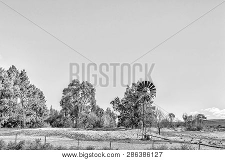 Farm Landscape On Road R356 Between Loxton And Fraserburg In The Northern Cape Province. 9 Water-pum