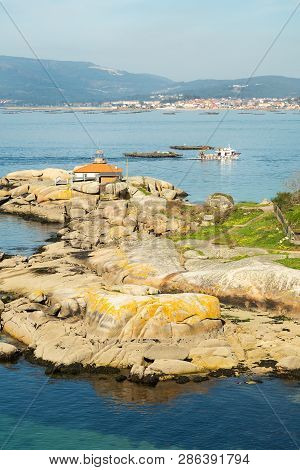 Rias Baixas Seascape With Punta Cabalo Lighthouse And Mussel Boat