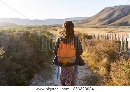 Rear view of a woman admiring Spanish landscape, Rambla del Playazo, Cabo de Gata - Nijar Natural Park, Spain
