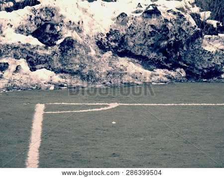 Training Soccer Field With Snow At Side Line In Winter Season.