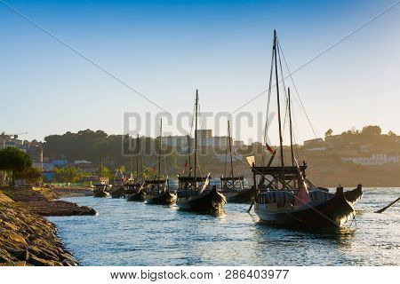 Porto, Portugal. Rabelo Boats On The Douro Riveri At Sunset