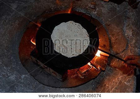 Pita Bread Baking On A Saj Or Tava On  Fire, Close-up.