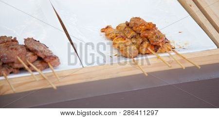 Traditional Street Food Cuisine, Thai Marinated Pork, Chicken Skewers (barbecue Pork Or Chicken Skew