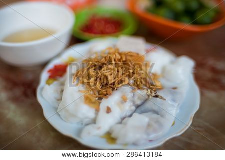 Traditional Vietnamese Banh Coun Street Food Meal Of Rice Stuffed Pancakes Decorated With Shallot. A