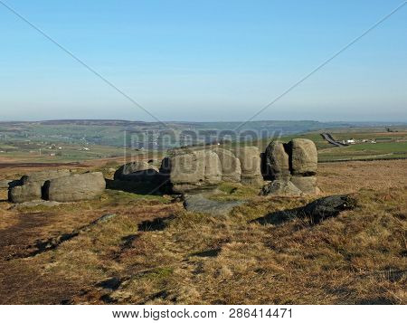 Rock Formations In Bridestones Moor In West Yorkshire With A Panoramic View Over Pennine Countryside