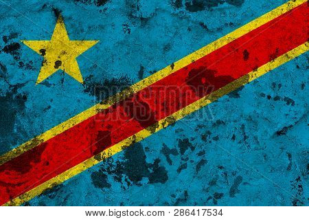 Democratic Republic of the Congo flag on old wall. Patriotic grunge background. National flag of Democratic Republic of the Congo