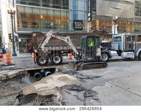 Construction Workers, Road Workers, Maintenance, Tearing Up Public Street To Replace Broken Pipes Be