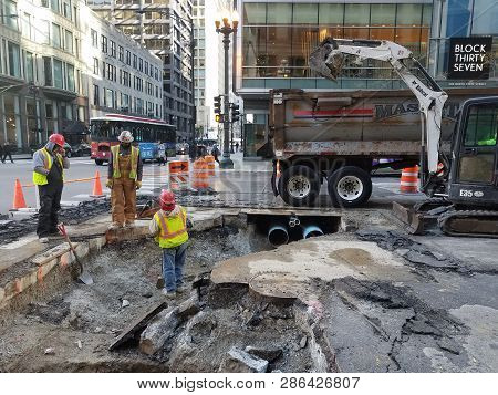 Construction Workers, Road Workers, Maintenance, Tearing Up Public Street To Replace Broken Pipes Be