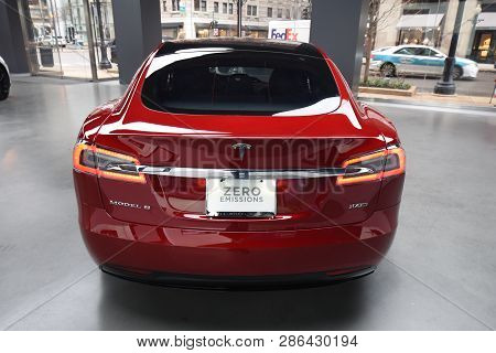 Tesla Deep Red Model S 100d All Electric Car On Display At A Tesla Car Dealership, Chicago, Il Novem