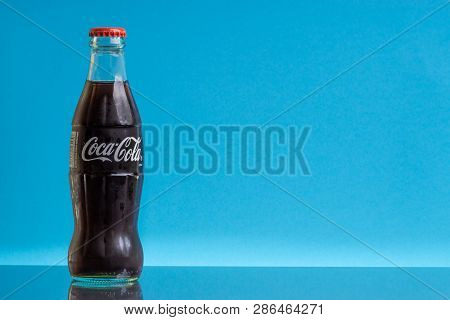 Kuala Lumpur, Malaysia - February 18,2019: Coca Cola Drink On Blue Background. Selective Focus And C