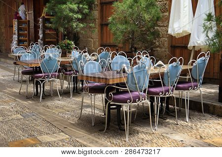 A Group Of Outdoor Restaurant Tables In Byblos, Jbeil, Lebanon.