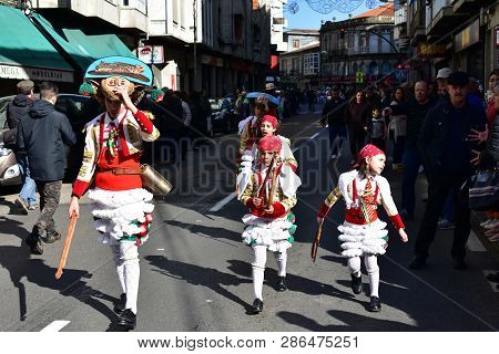 Verin, Spain, 24 Feb 2019. Famous Carnival And Street Parade With Cigarrons Costumes. Ourense Provin
