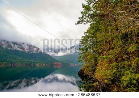 Morning fog in the mountains around Sproat lake in Vancouver Island, British Columbia, Canada