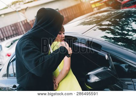 Bandit Man Holding Handgun To Hijack Hostage Woman Shocked At Parking Violence Concept.