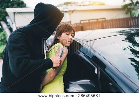Bandit Man Holding Handgun To Hijack Hostage Woman Shocked At Car Park Violence Concept.