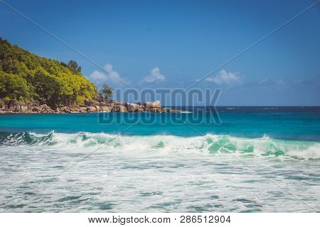 Beautiful Beach On Island Mahe, Seychelles. Turquoise Waves Of The Indian Ocean And Famous Granit St