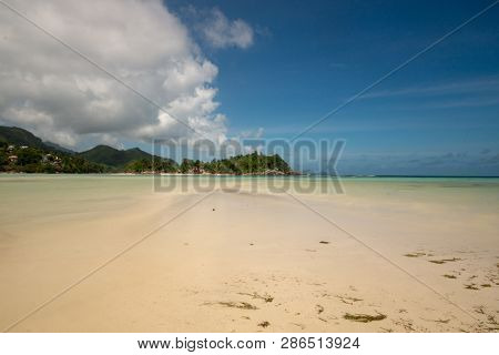 View On Low Tide In A Lagoon Of Mahe Island, Seychelles. Long Exposure Effect.