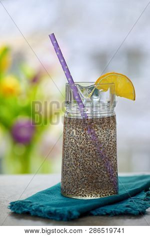 Chia Seeds In Glass Of Water On Table