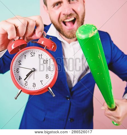 Discipline And Sanctions. Boss Aggressive Face Hold Alarm Clock And Baseball Bat. Man Suit Hold Cloc
