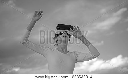 It Seems So Real. Cute Girl Play In Simulated Environment. Young Woman Gesturing In Vr Glasses. Pret