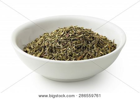 Dried Rubbed Thyme In A White Ceramic Bowl Isolated On White.