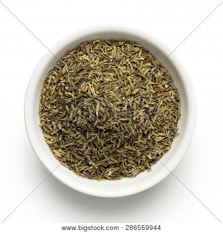 Dried Rubbed Thyme In A White Ceramic Bowl Isolated On White From Above.