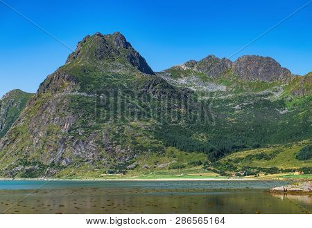 Norwegian Fjord Landscape Near Moskenes In The Heart Of Lofoten, Norway. Beautiful Mountain Scenery 