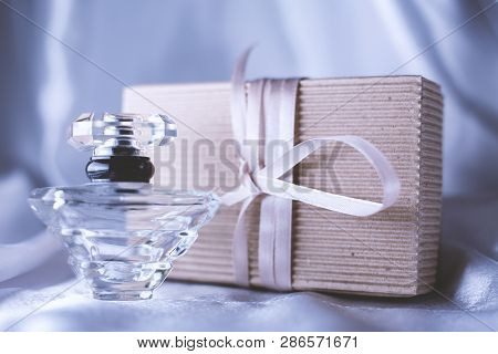 Perfume And Gift Box On Gray Background
