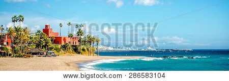 Picturesque Coast Turquoise Bay Of Mediterranean Sea Blue Sky, Palm Trees Orange Famous Landmark Bil
