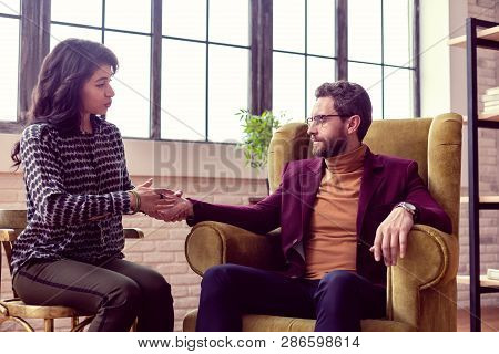 Beautiful Friendly Woman Touching Her Clients Hand