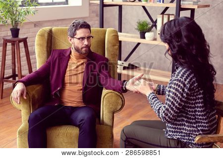 Nice Handsome Serious Businessman Giving His Hand