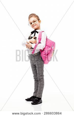 Back To School. Beautiful Little Girl Dressed Like A School Girl - In White Shirt And Gray Pants, Ro