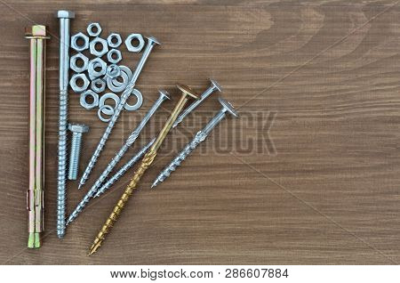 Several Various Metal Fasteners For Construction. Self-tapping Screw Screws, Bolt, Anker, Nuts, Wash
