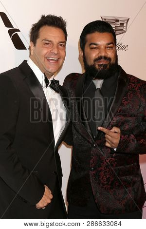 LOS ANGELES - FEB 24:  Craig DiFrancia, Adrian Dev at the Elton John Oscar Viewing Party on the West Hollywood Park on February 24, 2019 in West Hollywood, CA