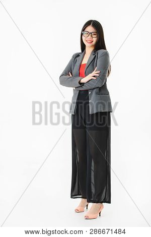 Full Length Studio Portrait Of Young Attractive Asian Woman, Long Black Hair, Wearing Glasses, In Ca