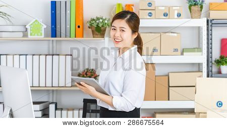 Young Beautiful, Attractive Asian Businesswoman With Pony Tail, White Shirt, Black Skirt, Hold Table