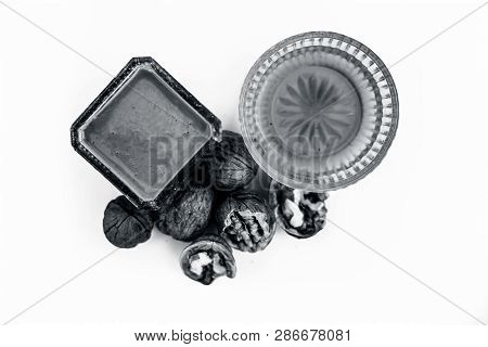 Close Up Of Best Home Remedy To Treat Anemia In A Glass Bowl Isolated On White Consisting Of Walnut