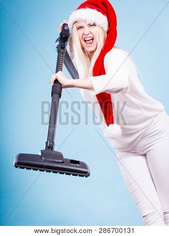 Woman Vacuuming The House, Last Minute. Teen Girl In Santa Helper Hat With Vacuum Cleaner, Angry Fur