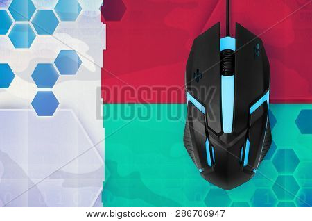 Madagascar Flag  And Computer Mouse. Concept Of Country Representing E-sports Team