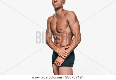 Attractive Caucasian Male Model In Black Underwear Showing His Sexy Body On A White Background. Port
