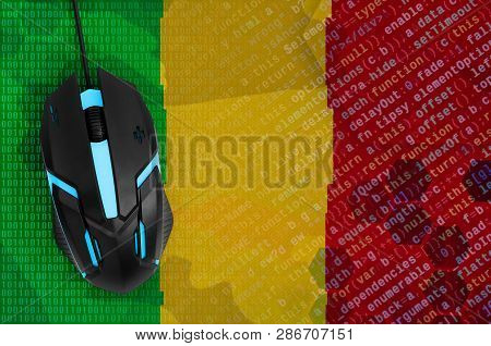 Mali Flag  And Computer Mouse. Digital Threat, Illegal Actions On The Internet