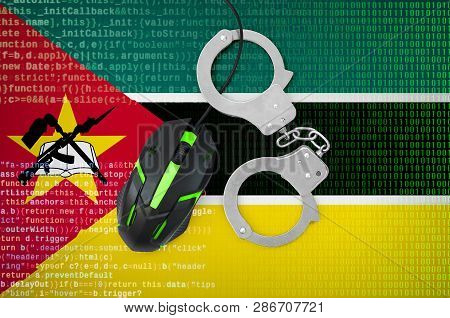 Mozambique Flag  And Handcuffed Computer Mouse. Combating Computer Crime, Hackers And Piracy