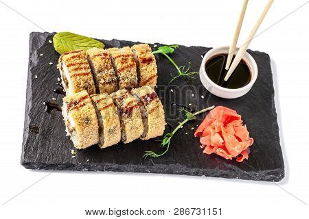 Concept Of Japanese Cuisine. Fried Roll In Deep-fried Banzai With Eel, Cucumber. Near Soy Sauce, Gin