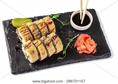 Concept Of Japanese Cuisine. Fried Roll In Deep-fried Banzai With Eel, Cucumber. Near Soy Sauce, Gin