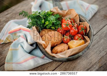 Tasty Traditional Georgian Dish Mchadi In The Pot On A Light Striped Tablecloth