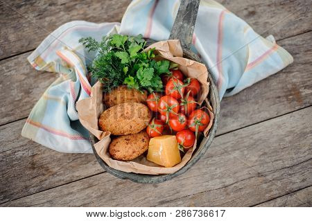 View From Above On The Tasty Traditional Georgian Dish Mchadi In The Pot On A Light Striped Tableclo