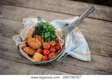 View From Above On The Georgian Mchadi In The Pot On A Light Striped Tablecloth